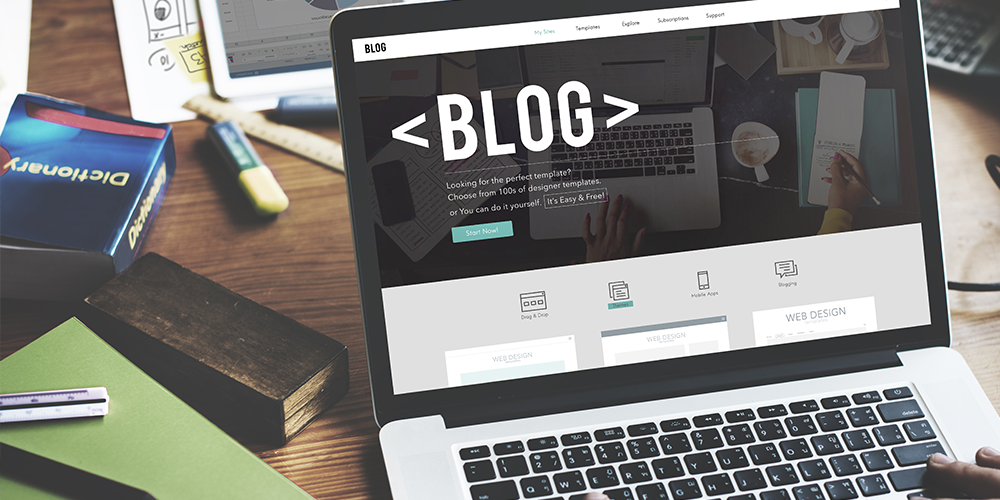 Marketer writes blog on why your business needs a blog on his laptop.