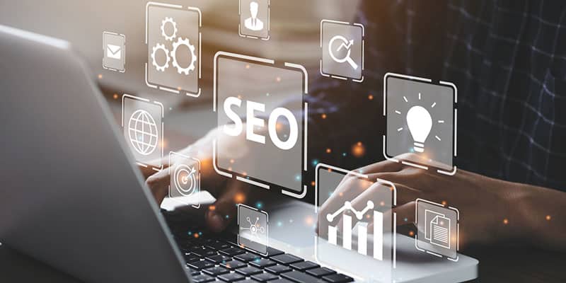 Person clicks on keyboard searching for advertising tips with icons floating out.