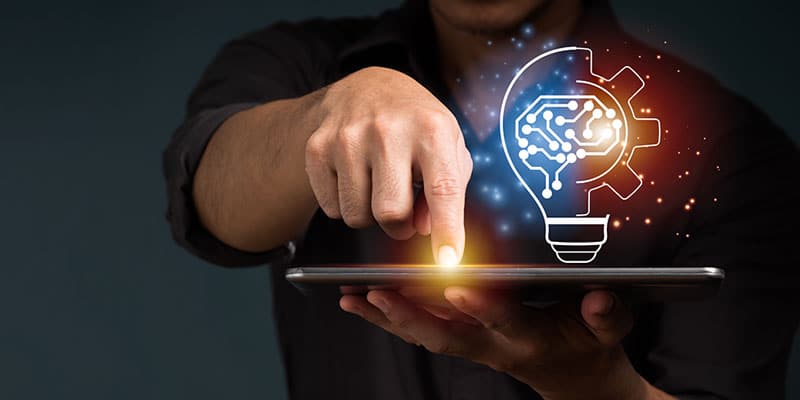 Branding experts presses button on tablet to illustrate ideas.