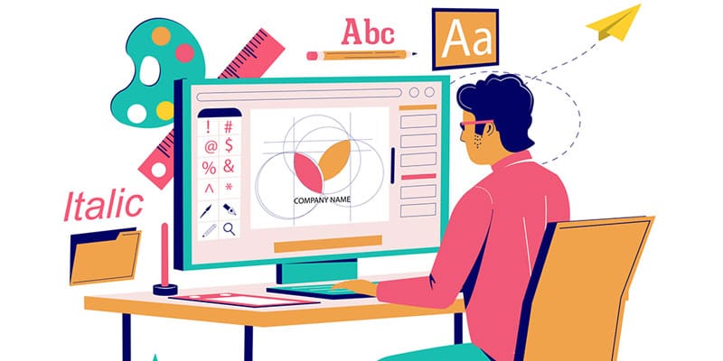 Artist sits at desk and computer and creates the best logo design for a client.