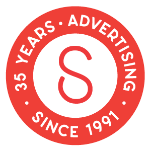 Sauce Advertising 35 years badge, red